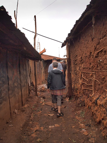 Walking to the Tabitha Clinic. Last year, CFK’s garbage collection program served 2,352 Kibera residents, employed 35 young people, and collected 31 tons of trash. 