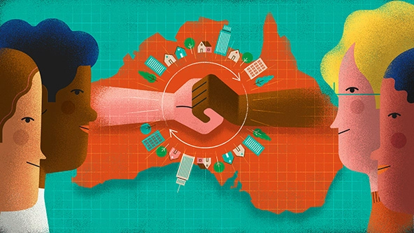 two hands from people of different races clasped over a map of Australia