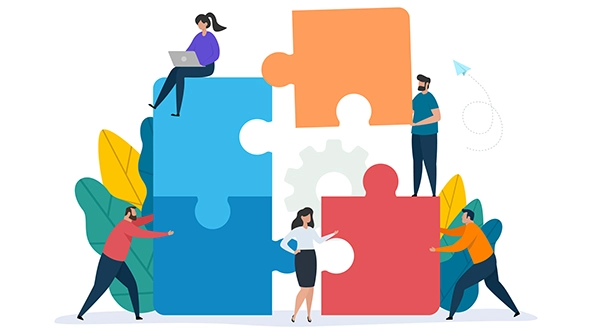 Illustration of people working together with giant puzzle pieces.