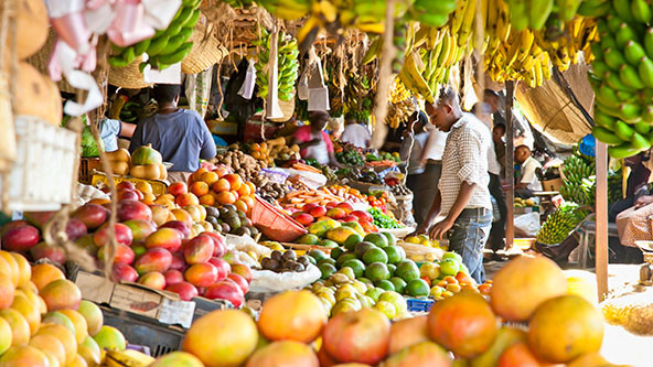 Ripe fruits stacked at a local fruit and vegetable market in Nairobi, Kenya.