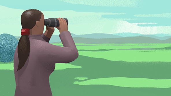 Woman looking through binoculars into the distance