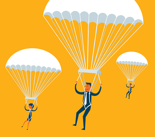 Three people parachuting from the sky