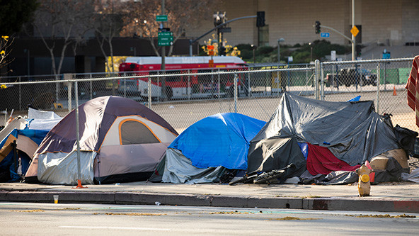 Tents on a sidewalk.