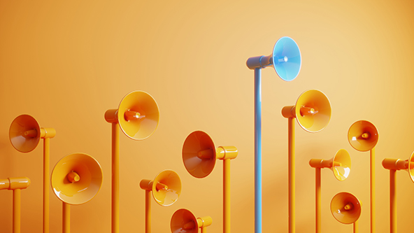 Blue-colored megaphone standing out in a crowd of orange megaphones