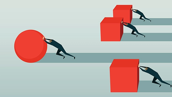 Three men pushing red cubes and one man, in the lead, pushing a red ball ahead of the others