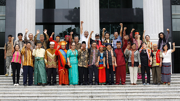 group of people standing on steps outside a building