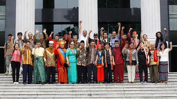 group of people standing on steps outside a building