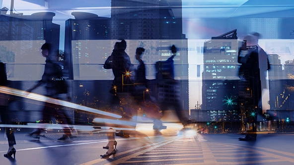 Multiple exposure of business people walking in city