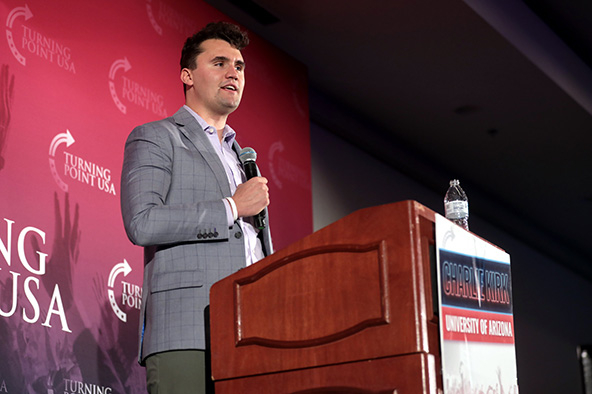 Man standing at a podium with microphone in his hand