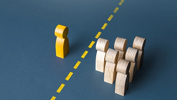 A person and a group of people are separated by a yellow line.