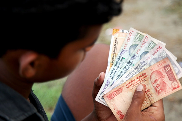 Teenage boy counting money