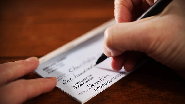 hand writing a check