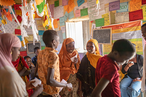 students in a classroom in Ethiopia with colorful posters on the walls
