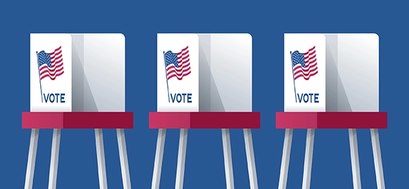 three voting booths with US flags