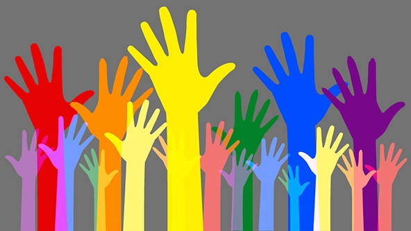 Colorful hands raised in the air