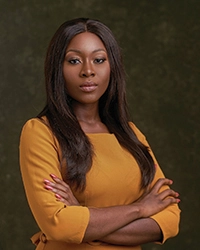 Women with arms crossed facing camera