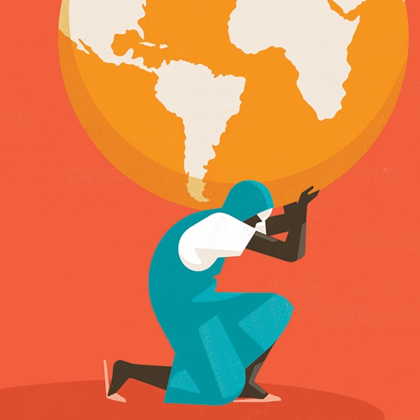 Woman kneeling and holding up a globe