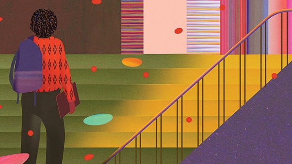 student with a backpack standing at bottom of staircase looking up