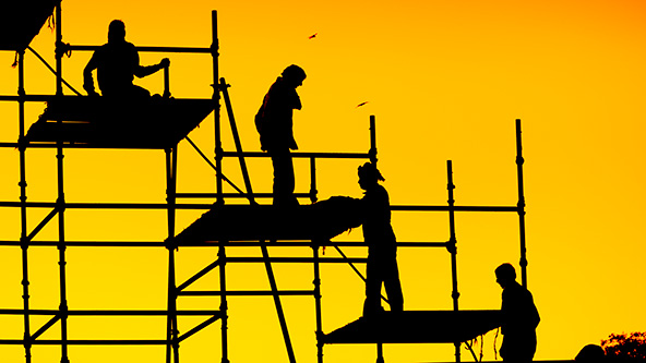 Construction workers on scaffolding