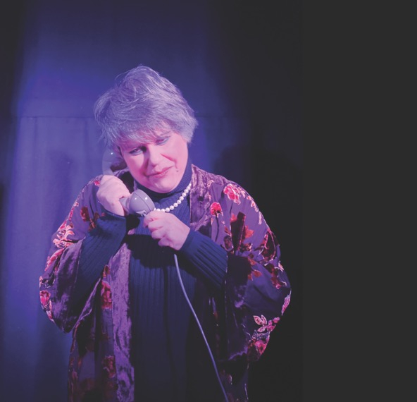 actress performing in shadowy space