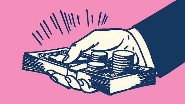 Hand holding out currency of paper bills and coins