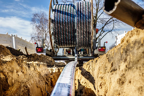 Fiberglass cable being put into the ground