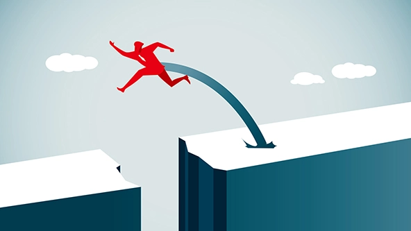 figure jumping over a wide break in the road