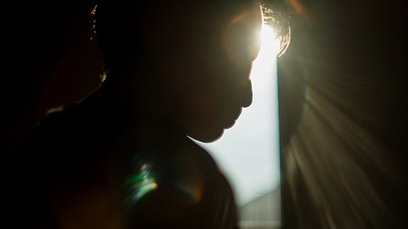 silhouette of man in shadows