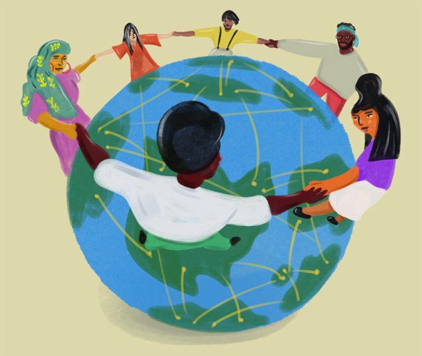 People holding hands standing on a globe