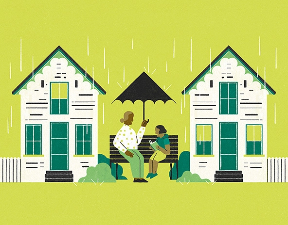 Older person sitting with child under umbrella