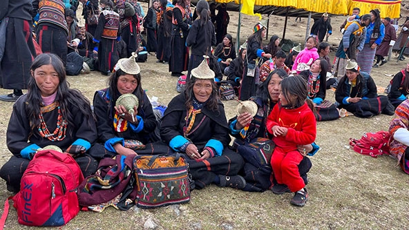 Four older women and a child in a Himalayan village