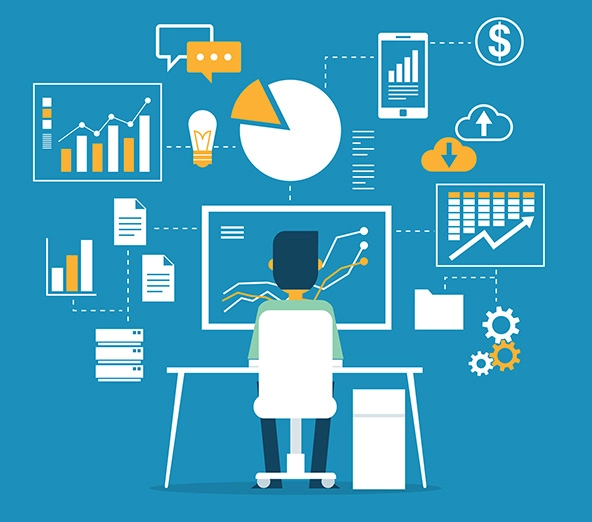 Person sitting at a desk looking at a screen with line graphs; background of other charts and graphs