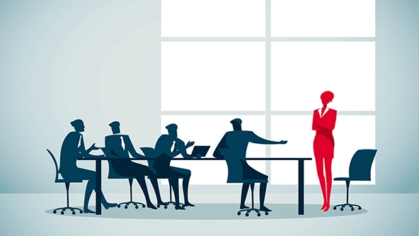 Person standing at the head of a table with four seated people