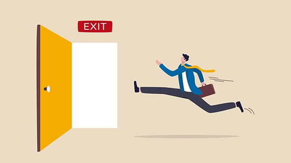 Figure in a suit running in hurry to emergency door with exit sign.