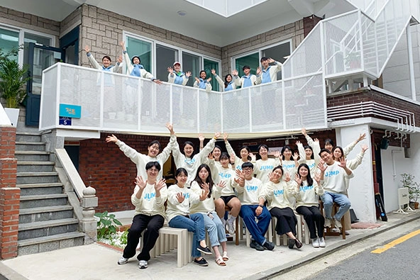 People sitting together outside a building