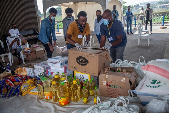 A group of men moving boxes of food in Ethiopia.