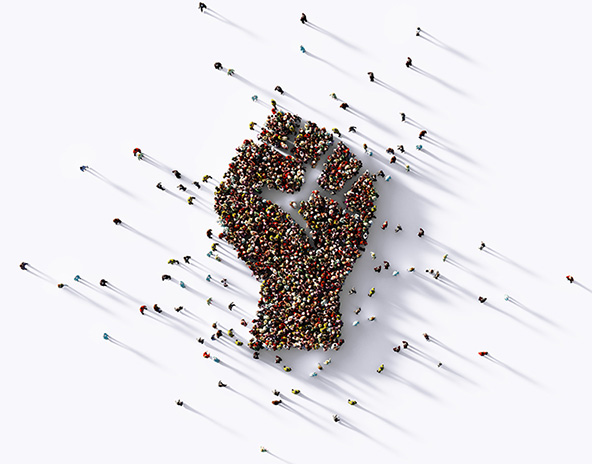 human crowd forming a fist symbol