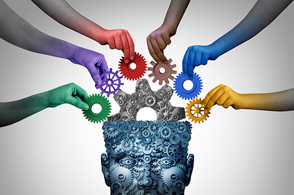 head made of gears with hands placing gears into the skull
