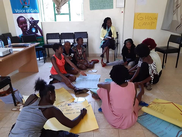 girls sitting in a circle on the floor