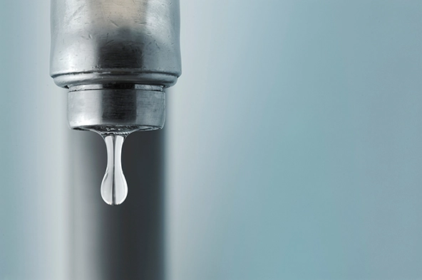sink faucet dripping with the water drop