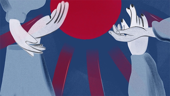 Outstretched hands over the background of Japanese flag