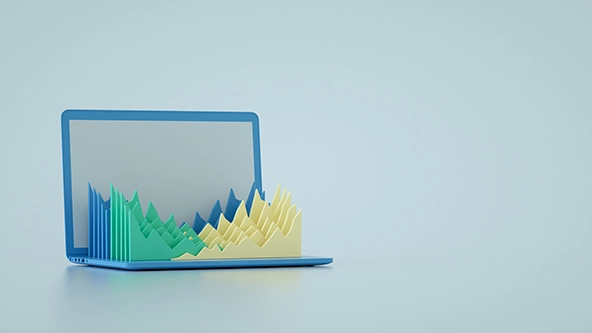 Laptop with bar charts springing up from the keyboard