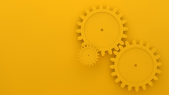 Three gears on a gold background