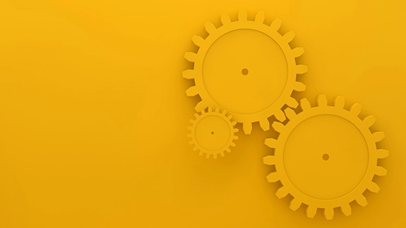 Three gears on a gold background