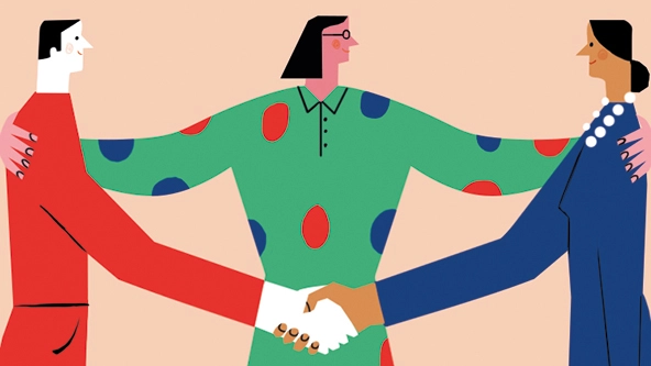 A person with their arms around two people shaking hands