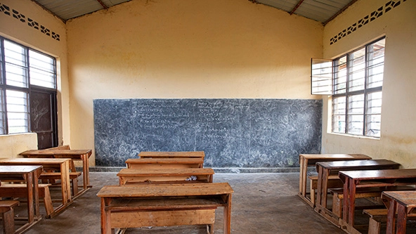 Desks and a chalkboard in a classroom