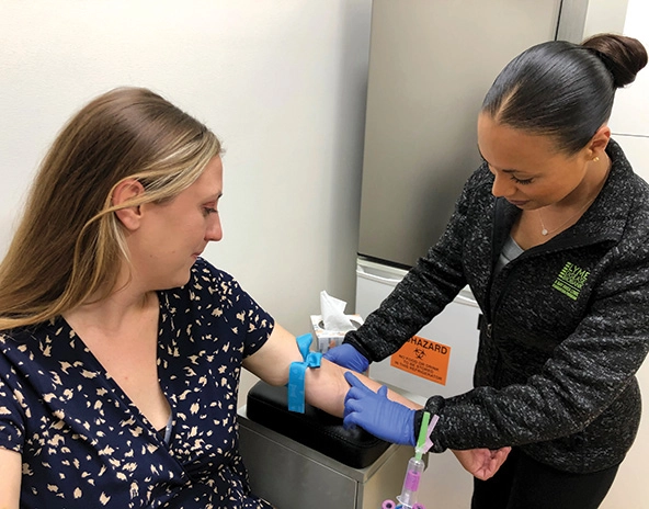 Woman having a blood sample drawn