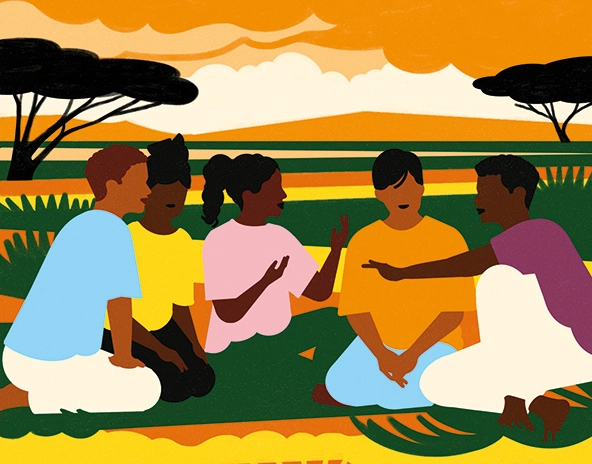 People sitting in grasslands talking together