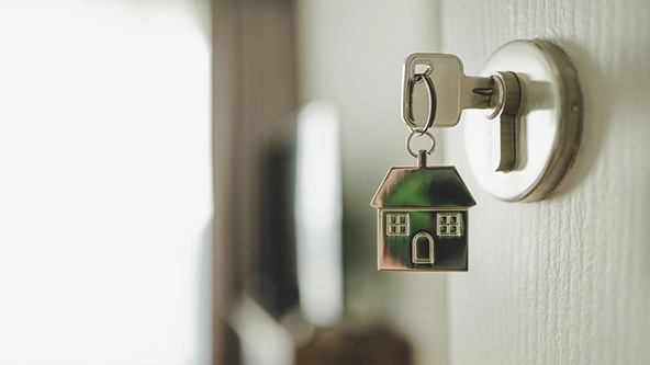 door handle with a key and a keychain shaped house