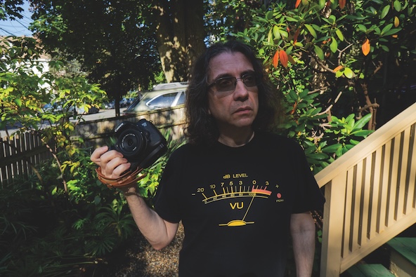 Jason Pramas holding a camera
